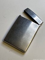Top view showing open lid and smooth silver plated surface with minor wear