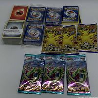 Main assortment showing all booster packs, energy cards, and stacks of cards