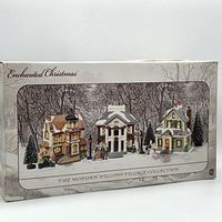 Box of The Woburn Willows Village Collection, showing three porcelain Christmas houses with snowy trees and figures on the front of the box.