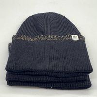 Stack of three black wide cuffed ribbed knit beanies with metallic stripe detail and BP logo tag visible on the cuff.