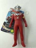 Front view of the Ultraman Leo figure with attached original tag showing Japanese branding and product details.