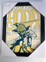 Full view of the framed Yoda art print with corner protectors on.