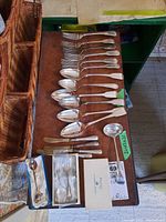 Six plain dinner forks at top, six dinner spoons below, four butter knives at bottom