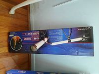 Box of Science Mate 45x40mm Telescope showing product image and space shuttle launch picture.