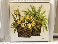 Frontal view of the Joan Mitchels print showing two wicker baskets, one with yellow tulips and the other with ferns, on a white background.