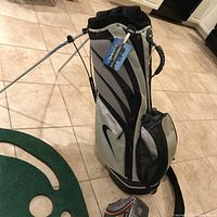 Lightweight Nike golf carry stand bag showing front view with compartments, pockets, and Nike logo.