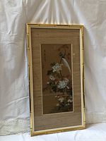 Full framed silk watercolor artwork showing bird with flowers in bamboo style frame.