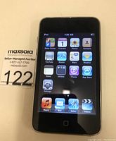 Front view of iPod Touch showing home screen with iOS apps.