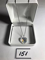 Front view of the Swarovski heart crystal pendant necklace displayed in a white jewelry box.