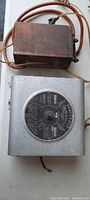 Full view of the antique vari-volt voltmeter and accompanying transformer box with wires visible.