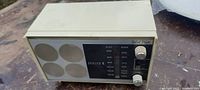 Photo of the Zenith countertop radio front panel showing speaker grills and tuning dials, model details visible