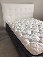 Mattress and headboard together, showing overall set on foundation.