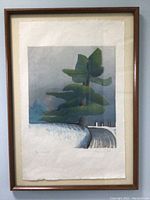 Front photo of framed art print showing the stylized tree and landscape with visible mat and wooden frame.