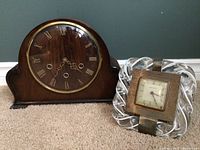 Smiths English wooden mantel clock and New Haven glass desk clock side by side