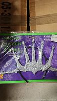 Snow Queen silver crown headband in packaging showing detailed pointed design