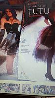 Boxed packaging showing "Vampiress Burlesque Tutu" costume set with tutu and optional corset top, highlighting one type of burlesque tutu included in the lot.