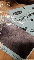 Packaged black hair net with Tish & Snookys Manic Panic branding