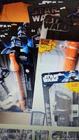 Image shows multiple Star Wars figures in original packaging, including Clone Troopers and Jango Fett.
