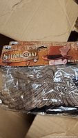 Wing hat bands packaged branded as Steampunk Apparel & Accessories with wing design.