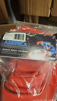 Close up of 2 Child Captain America Boot Covers in original packaging