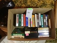 top-down view of cardboard box with two tiers of Atari game boxes