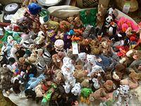 Wide overhead shot showing the full assortment of Beanie Babies spread out on a surface