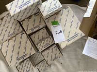 Several unopened Princess House boxes labeled with various lead crystal animal names and item numbers.