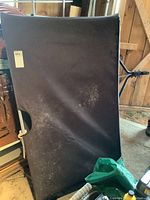 Black fabric leaf collection bag folded