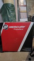 Red and black Mercury Propellers box with branding and product info.