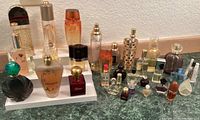 Wide view of all perfume bottles arranged on risers and countertop