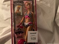 Entire boxed Barbie doll in bathing suit, front view showing full packaging and contents