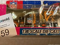 Photo showing close-up of the tractor portion of the die-cast tractor-trailer featuring Cleveland Browns team logos and colors