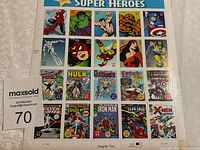 Photo showing full sheet of Marvel Comics Super Heroes self-adhesive stamps with 24 stamps featuring various characters and comic covers.