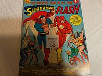 Front cover of Limited Collectors' Edition comic featuring Superman and The Flash in a race, with original $1.00 price and colorful character artwork.