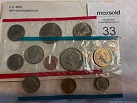 View of the full U.S. Mint 1979 Uncirculated Coin Set sealed in original packaging showing coins with visible details and protective plastic.