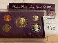 1992 United States Mint Proof Set containing five proof coins in purple plastic holder with original maroon box.