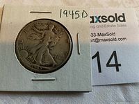 Front view of 1945-D Walking Liberty half dollar coin in protective holder, showing coin design and date.