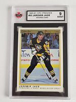 Front view of the 1990-91 OPC Premier #50 Jaromir Jagr Rookie Card graded 9 Mint by KSA showing Jagr in Penguins uniform on ice.