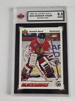 Front view of the Dominik Hasek rookie hockey card graded 9.5, showing the card details and player image.
