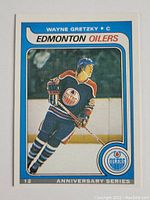 Front view of Wayne Gretzky rookie card showing image in Edmonton Oilers uniform and anniversary series design.
