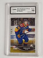 Clear front view of 2012 Connor McDavid rookie hockey card graded Gem MT 10 by GMA in Erie Otters uniform showing full card surface and label