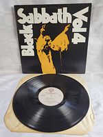 Front side of Black Sabbath Vol 4 album cover with vinyl LP on inner protective sleeve in front of it.
