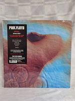 Front cover of Pink Floyd Meddle Remastered sealed vinyl LP showing album art and promotional sticker.