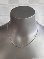 Full view of the sterling silver chain necklace displayed on a necklace stand.