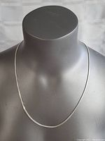 Full view of the 24-inch sterling silver necklace displayed on a mannequin bust.