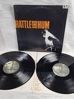 Photo of both vinyl records and lyric insert inside album cover