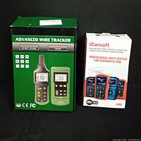 Boxes of Advanced Wire Tracker and iCarsoft Professional Car Diagnostic Tool showing front packaging and product images.