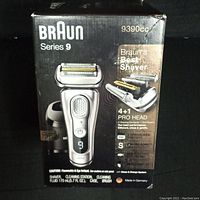 Front view of the Braun Series 9 9390cc shaver's outer packaging with product branding and features.