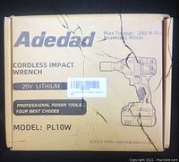 Box with printed details of Adedad Cordless Impact Wrench 20V Lithium Model PL10W showing max torque 240 ft-lbs, brushless motor.