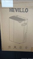 Box showing front view illustration of Hevillo dehumidifier and brand logo